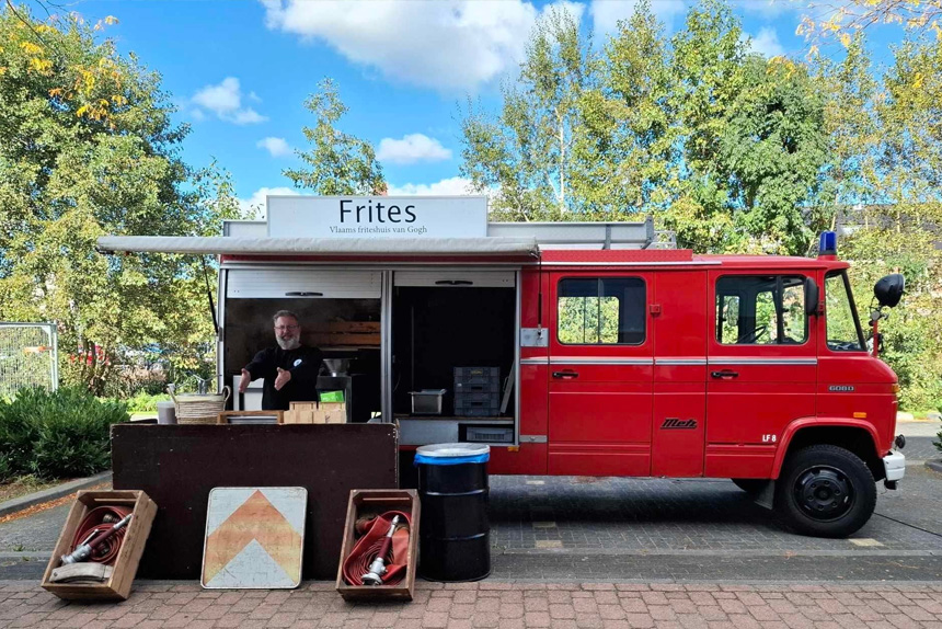 a man standing in front of a food truck