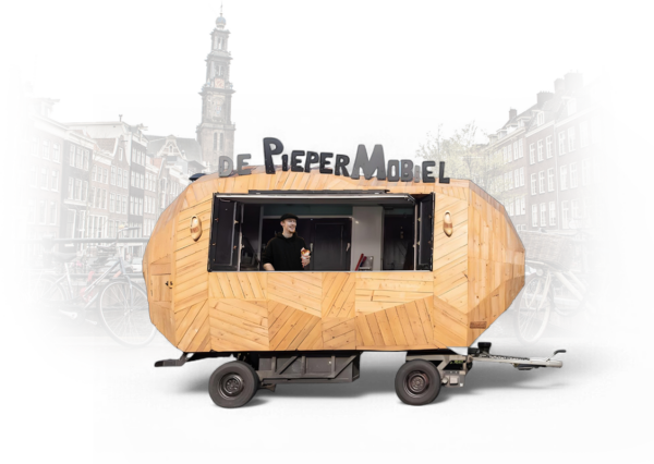 a man standing in a small wooden trailer